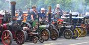 Row of miniature steam powered vehicles at Statfold Country Park, Tamworth