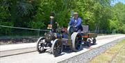 Man drives miniature steam powered vehicle at Statfold Country Park, Tamworth