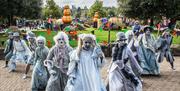 The Alton Ancestors - dancers in spooky costumes - perform a routine