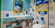 Bathrooms are well-equipped containing baths with showers over and extra features like children's toilet seats and steps.