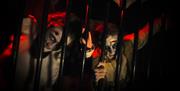Scary characters behind bars in a maze at Alton Towers