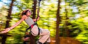 Woman  on zipline at Go Ape