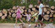 Image shows a family enjoying a summer walk