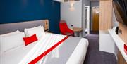 One of the comfortable, modern bedrooms