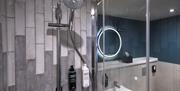 The clean and spacious bathroom of an Ibis Styles room