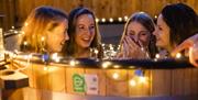 A group of women drinking wine in a Hot Tub