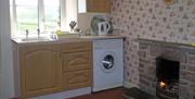 Kitchen with the cosy fire!