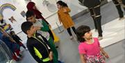 Young visitors explore one of the galleries at the Brampton Museum, Staffordshire
