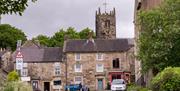 Longnor Village high street, shops fronts and the church in the background