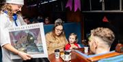 A family with one of the performers from The Polar Express