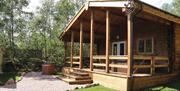 Stay in one of the timber lodges at Quarry Walk Park