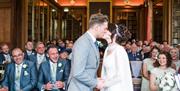 Sealing the marriage with a kiss