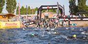 The race starts early in the morning with an open water swim across Chasewater.