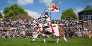 A knight prepares to entertain the crowds at the Tamworth Castle jousting competition on St George's Day