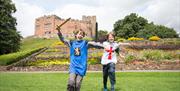 Tamworth Castle Pleasure Grounds, Tamworth, Staffordshire. Boys role playing knights in the grounds.