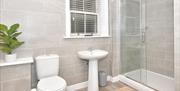 A view of the bathroom at Room 1 at The Royal Oak, showing the toilet, sink and shower