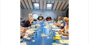 Group of people creating paintings