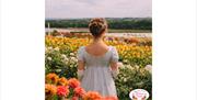 A girl in Regency‑style dress standing among colourful summer flowers