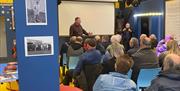 People enjoying a talk at the Philip Astley Centre