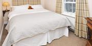 Room 2 at The Fountain Inn, giving a closer look at the comfortable bed and furnishings