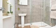 Bathroom image, showing shower, sink and toilet