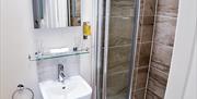 One of the bathrooms, with shower and sink on view