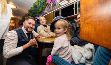 Image shows a family enjoying a festive day out on The Polar Express