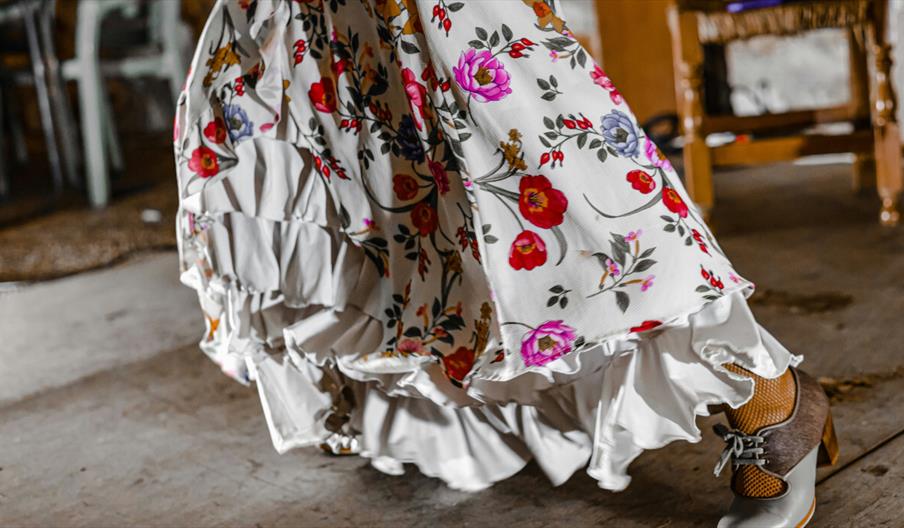 White dress with ruffles and bright flowers White dress with ruffles and bright flowers